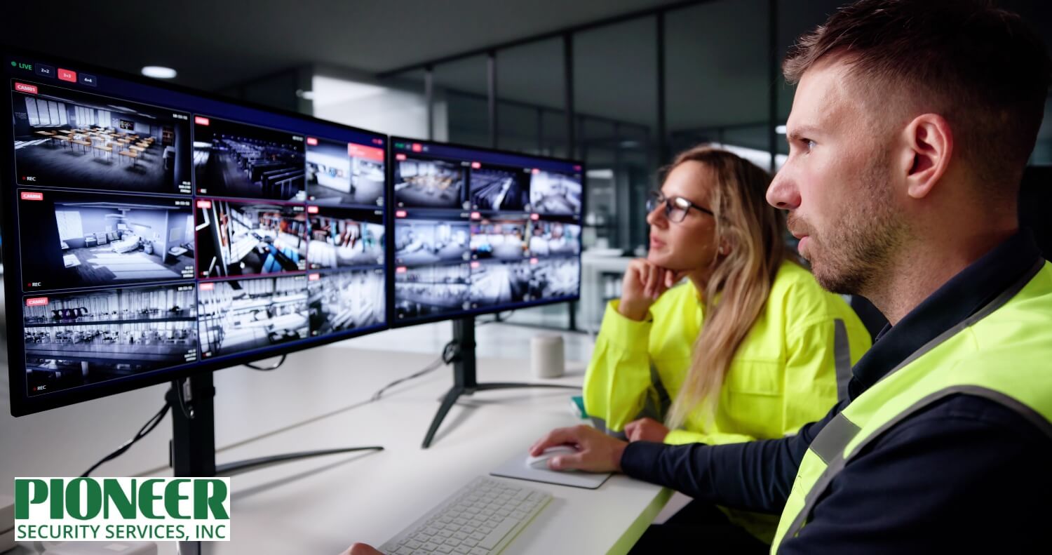 CCTV Security Monitoring Control Room Security operators using control room software to view live feeds from multiple surveillance cameras on dual monitors