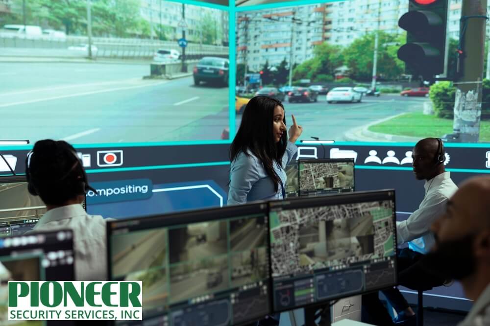 Security team manager explaining live video monitoring costs for urban traffic and city surveillance systems, with multiple camera feeds on screens.