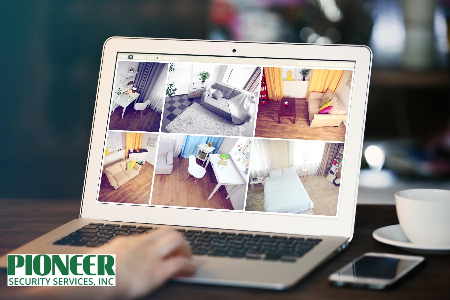 home-security-monitoring-on-laptop Person checking live home security camera feeds on a laptop for remote monitoring